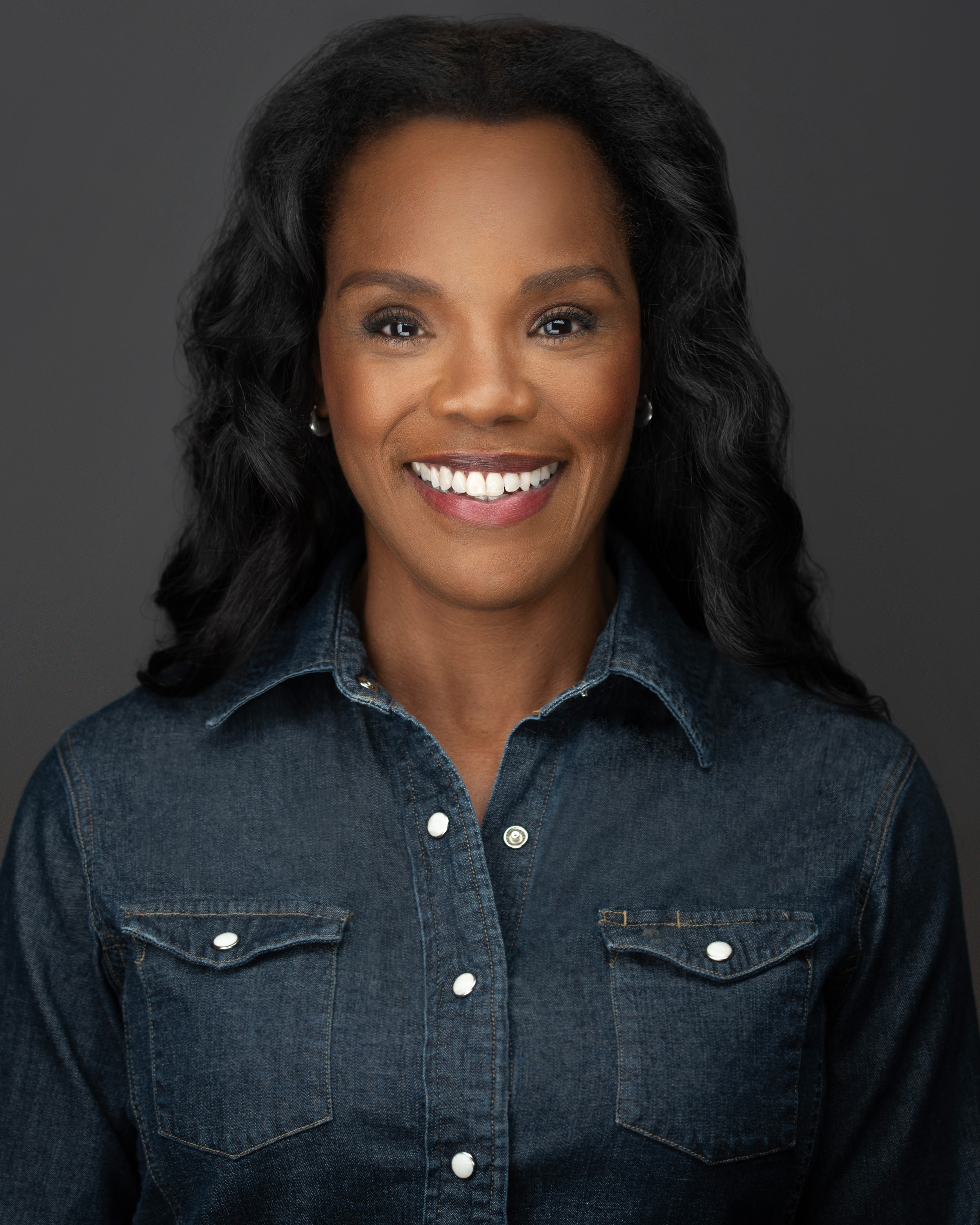 Rosalyn Coleman smiling in a blue shirt